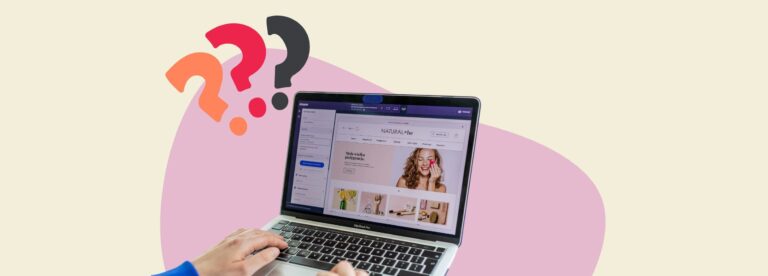 Laptop showing an online store with colourful question marks, symbolising curiosity about what a Pinterest Manager does for e-commerce growth.