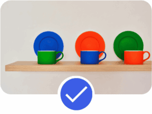 Pinterest Account example featuring colourful cups and plates on a shelf with verification check icon, illustrating organised visual branding within a well-optimised Pinterest Account.